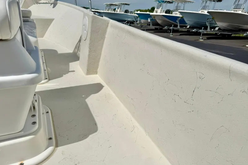 Slide: The Image of 2014 May-Craft 1800 Skiff interior view, showcasing seating and deck details. - 34