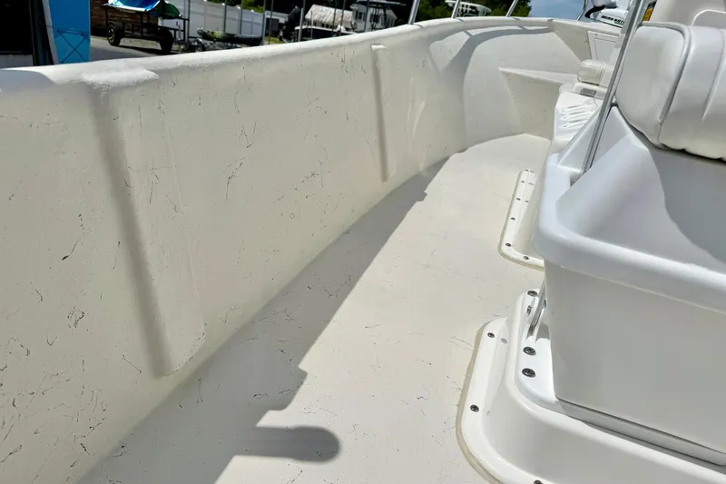 Slide: The Image of 2014 May-Craft 1800 Skiff interior view, showcasing clean white deck and seating. - 35