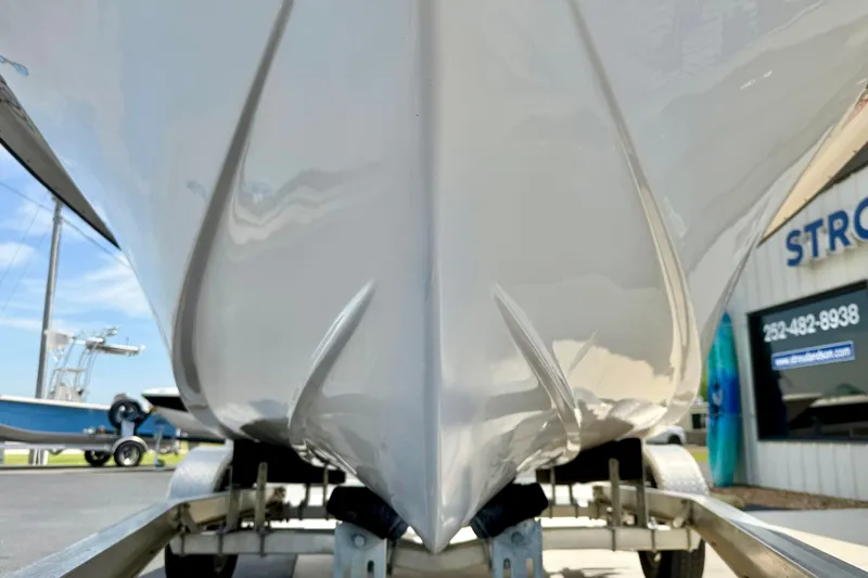 Slide: The Image of 2014 May-Craft 1800 Skiff boat hull on trailer, outdoor dealership display. - 9