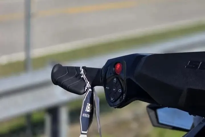 Slide: The Image of Handlebar controls of a 2026 Sea-Doo GTX 230 with key fob attached. - 13