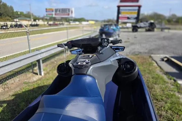 Slide: The Image of 2026 Sea-Doo GTX 230 jet ski parked near a road with blurred background. - 15