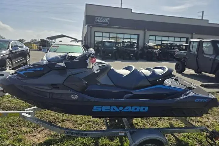 Slide: The Image of 2026 Sea-Doo GTX 230 jet ski on trailer, parked outside dealership. - 4