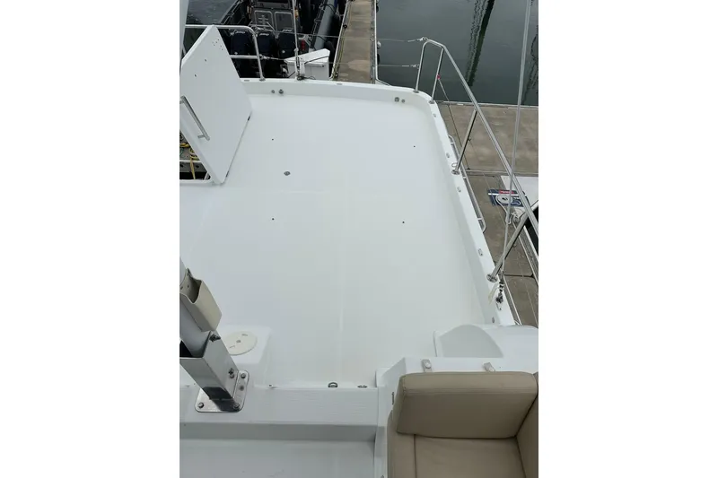 Slide: The Image of 2011 Beneteau Swift Trawler 34 Fly deck view, featuring spacious layout and railing. - 22