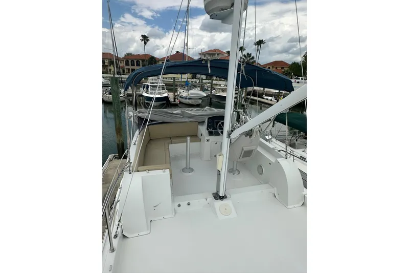Slide: The Image of 2011 Beneteau Swift Trawler 34 Fly at marina, featuring spacious flybridge and seating area. - 25