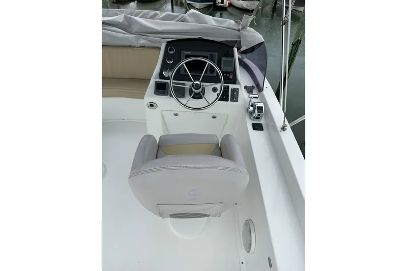Slide: The Image of Helm station of 2011 Beneteau Swift Trawler 34 Fly with steering wheel and controls. - 26