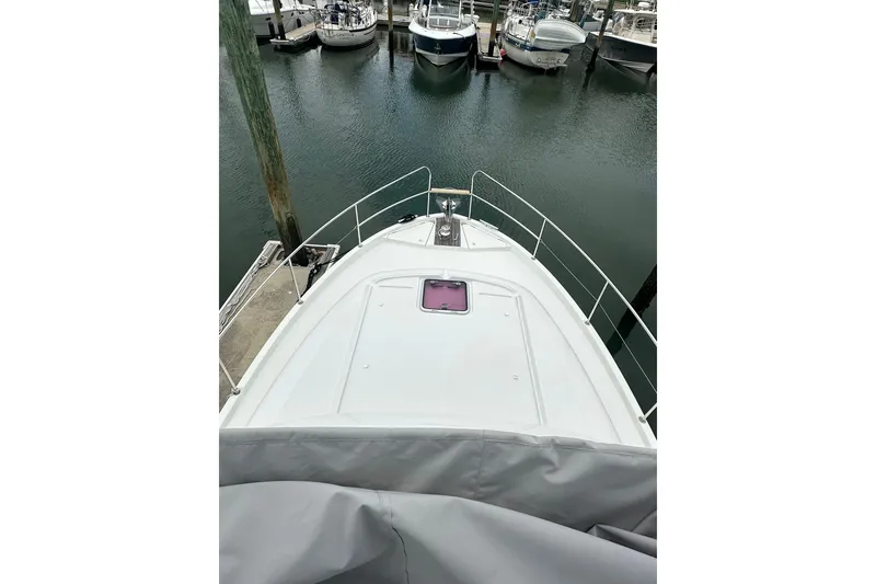 Slide: The Image of 2011 Beneteau Swift Trawler 34 Fly docked at marina, view from bow. - 27