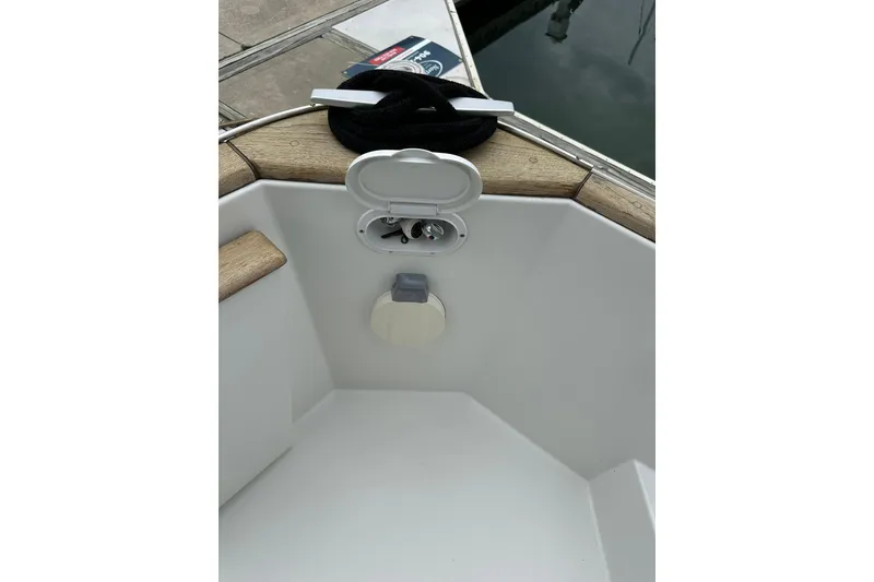 Slide: The Image of Beneteau Swift Trawler 34 Fly 2011 deck detail with open hatch and dock view. - 29
