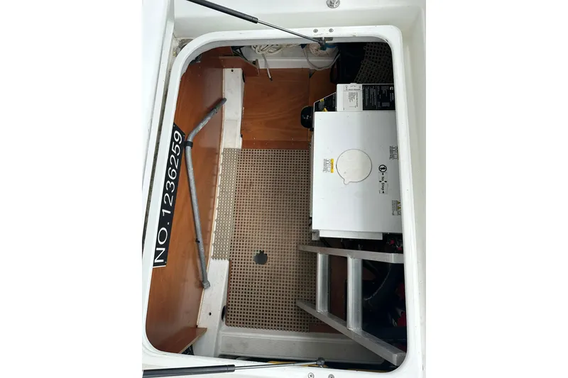 Slide: The Image of Engine compartment of 2011 Beneteau Swift Trawler 34 Fly with equipment and serial number. - 30