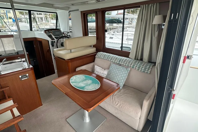 Slide: The Image of Interior of 2011 Beneteau Swift Trawler 34 Fly with cozy seating and helm station. - 35