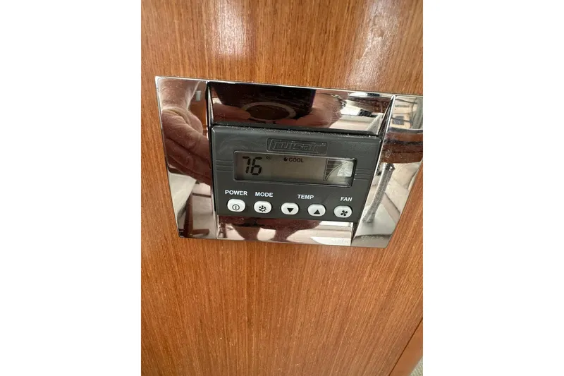 Slide: The Image of Thermostat control panel on 2011 Beneteau Swift Trawler 34 Fly yacht interior. - 41