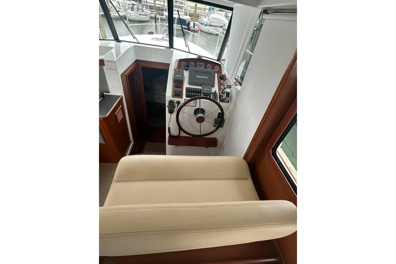 Slide: The Image of 2011 Beneteau Swift Trawler 34 Fly helm with steering wheel and navigation equipment. - 42