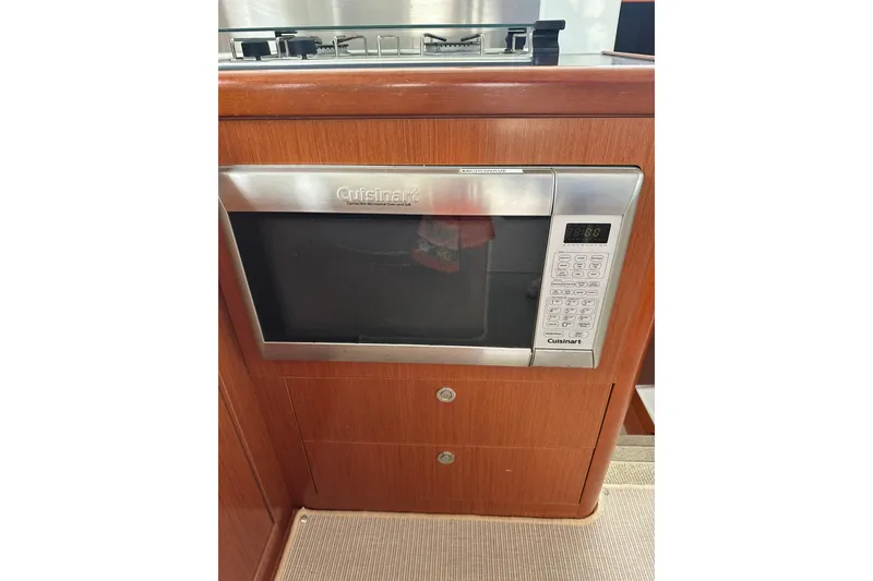 Slide: The Image of Cuisinart microwave in 2011 Beneteau Swift Trawler 34 Fly kitchen area. - 45