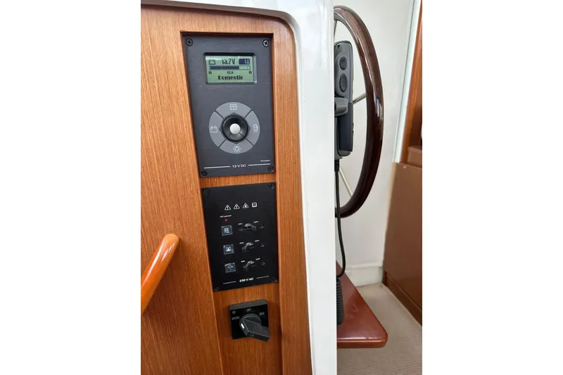 Slide: The Image of Control panel and steering wheel of a 2011 Beneteau Swift Trawler 34 Fly. - 48