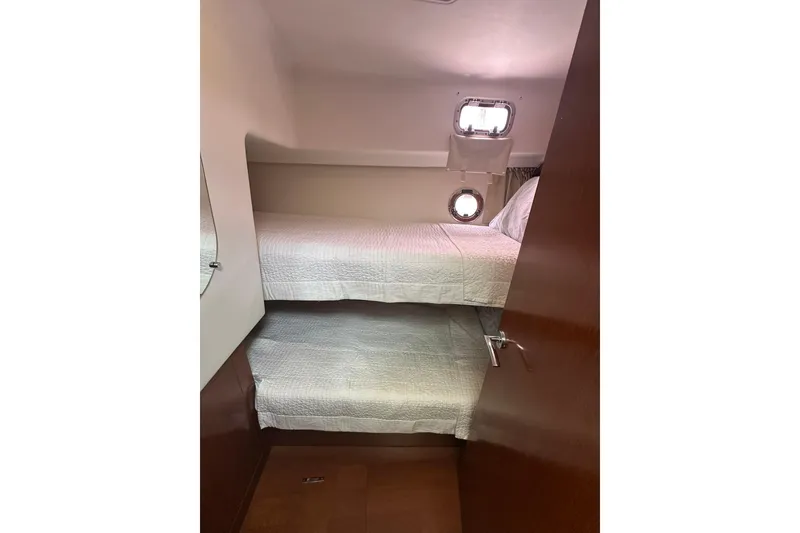 Slide: The Image of Cabin interior of 2011 Beneteau Swift Trawler 34 Fly with bunk beds. - 49