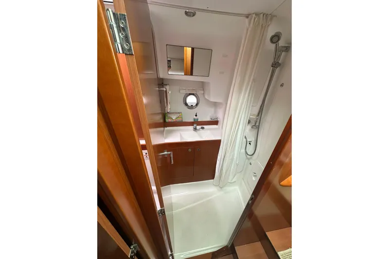 Slide: The Image of Bathroom interior of 2011 Beneteau Swift Trawler 34 Fly with shower and sink. - 52