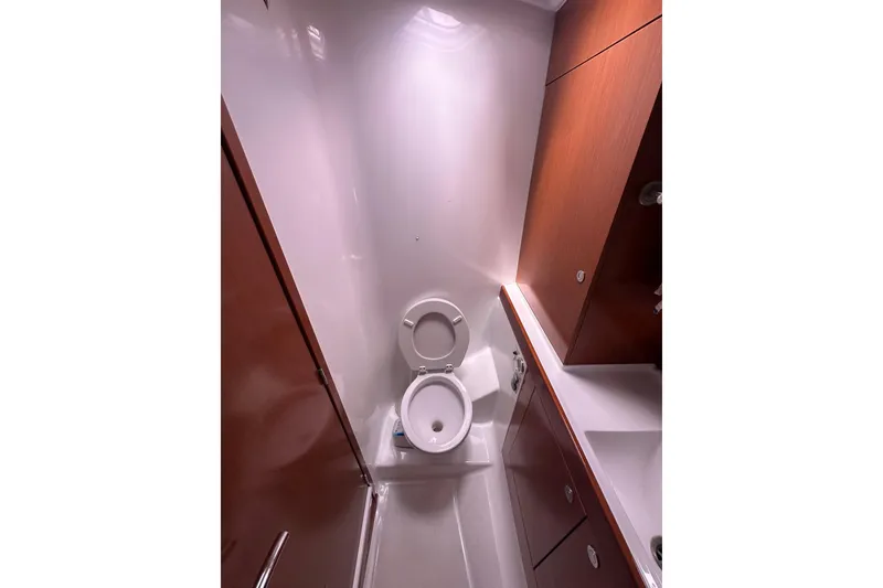 Slide: The Image of Bathroom interior of 2011 Beneteau Swift Trawler 34 Fly with wooden cabinetry. - 53