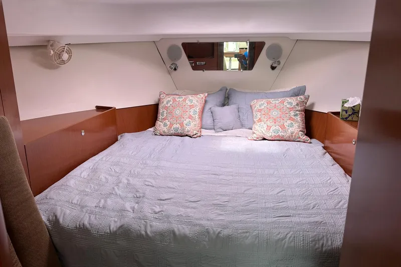 Slide: The Image of Cozy cabin interior of 2011 Beneteau Swift Trawler 34 Fly with decorative pillows. - 55