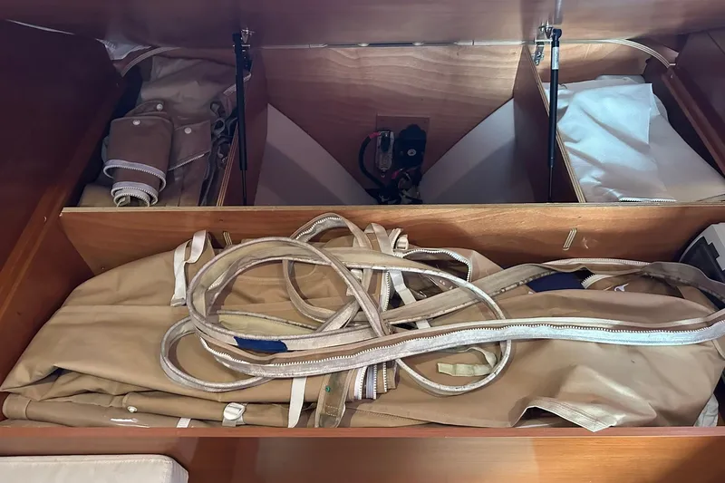 Slide: The Image of Storage compartment on a 2011 Beneteau Swift Trawler 34 Fly with canvas and ropes. - 61