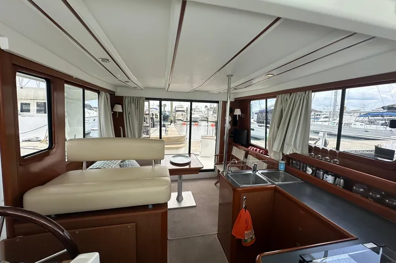 Slide: The Image of Interior of 2011 Beneteau Swift Trawler 34 Fly, featuring spacious seating and kitchen area. - 63