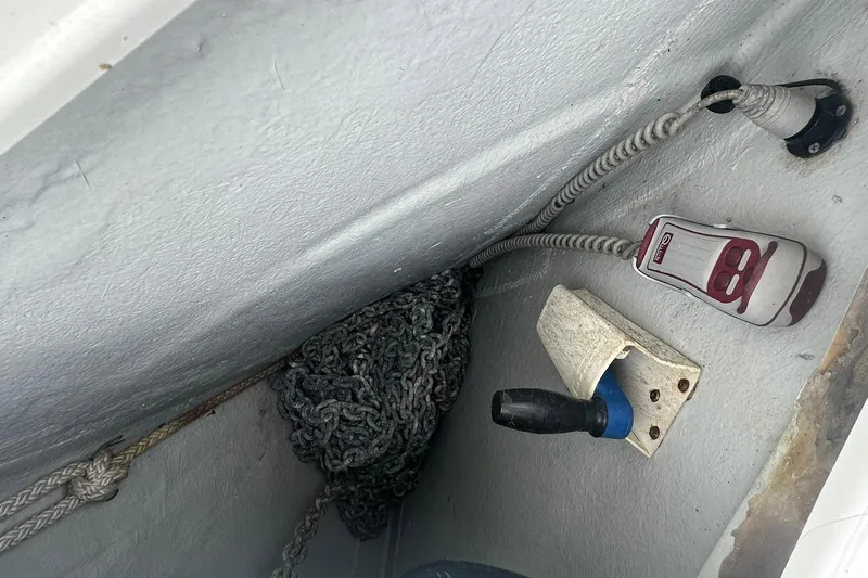 Slide: The Image of Storage compartment of a 2011 Beneteau Swift Trawler 34 Fly with coiled chain and equipment. - 8
