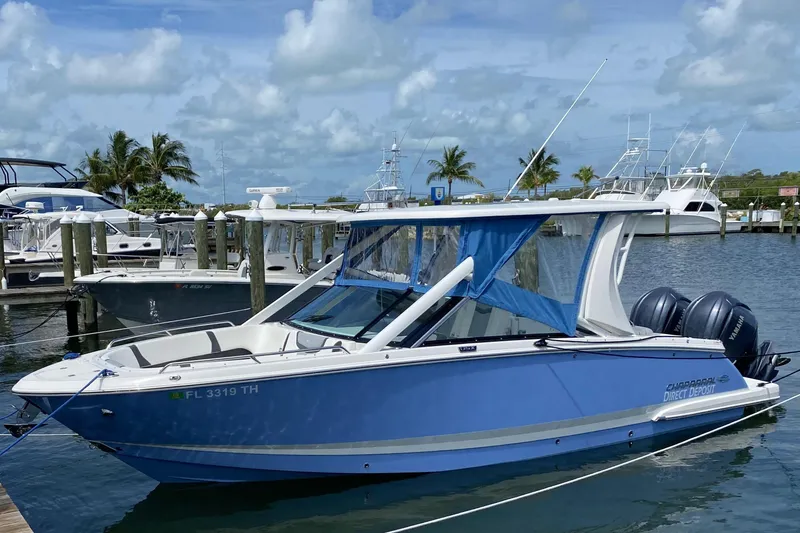 The Image of 2022 Chaparral 280 OSX boat docked at marina with clear skies. - 0