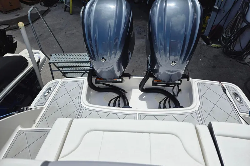 Slide: The Image of 2022 Chaparral 280 OSX boat with dual outboard engines, rear deck view. - 14