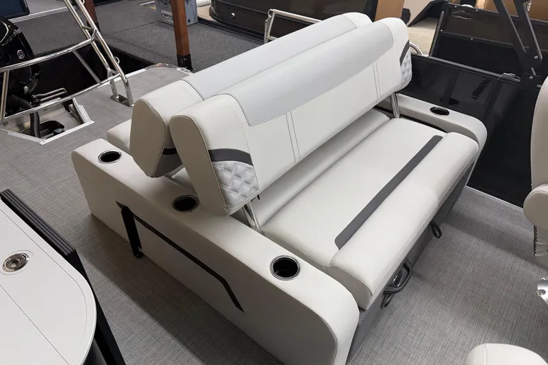 Slide: The Image of Luxurious seating on 2025 Crest Classic 240 pontoon boat, featuring cup holders and elegant design. - 10