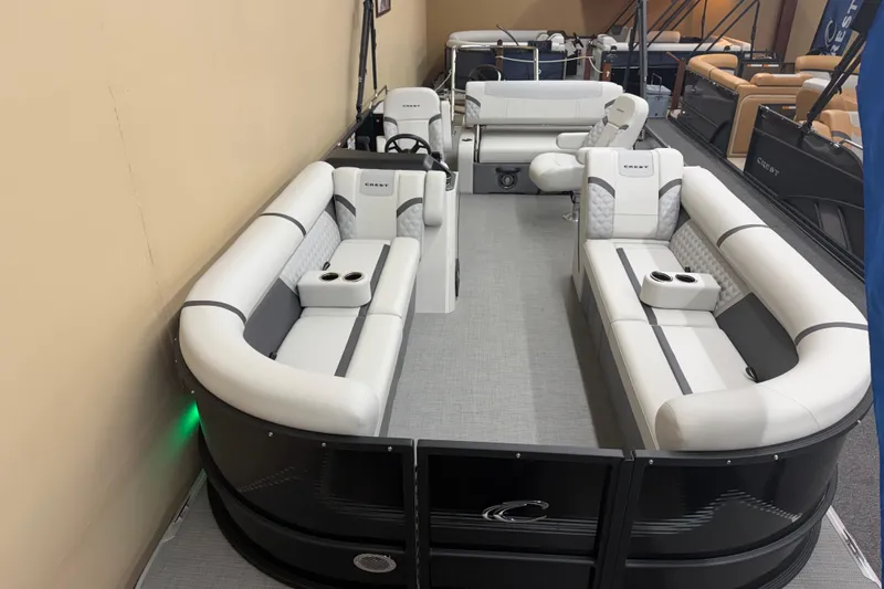 Slide: The Image of 2025 Crest Classic 240 pontoon boat with luxurious seating and modern design. - 2
