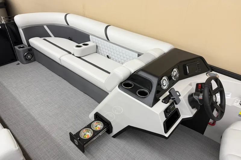 Slide: The Image of 2025 Crest Classic 240 boat interior with sleek seating and modern dashboard design. - 5