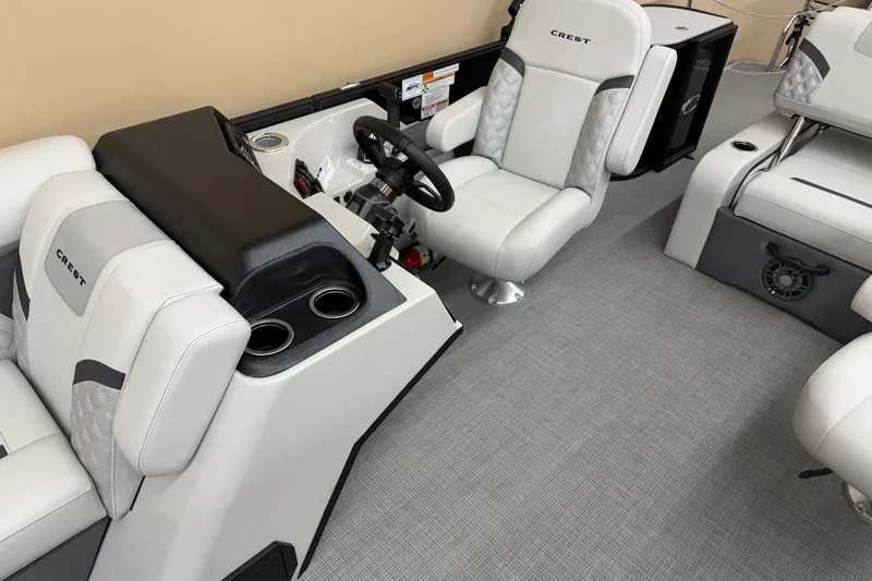 Slide: The Image of 2025 Crest Classic 240 boat interior with plush seating and modern steering console. - 9