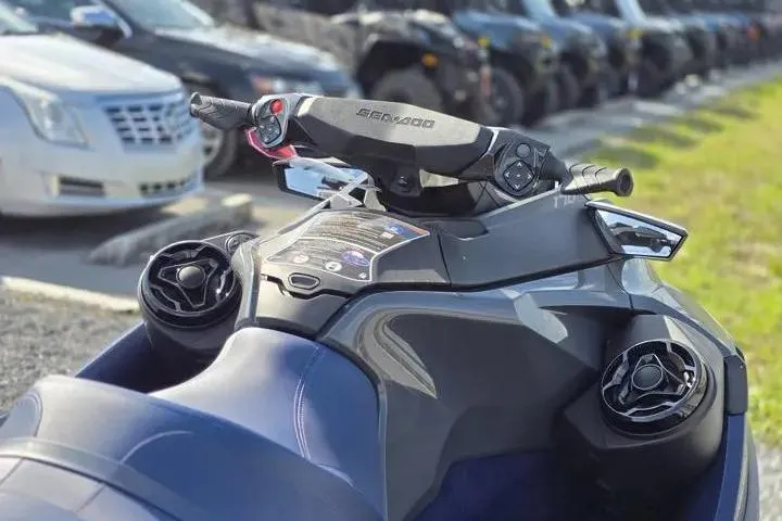 Slide: The Image of 2026 Sea-Doo GTX 170 jet ski dashboard with controls and speakers, parked outdoors. - 13
