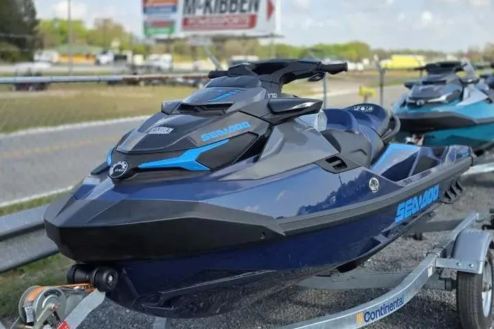 Slide: The Image of 2026 Sea-Doo GTX 170 jet ski on trailer, parked outdoors. - 2