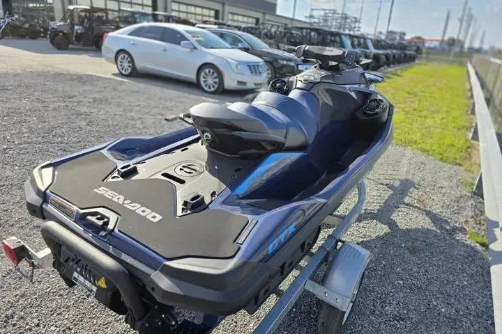 Slide: The Image of 2026 Sea-Doo GTX 170 jet ski on trailer, parked outdoors in a dealership lot. - 6