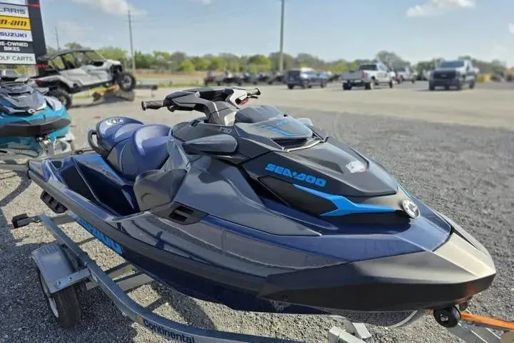 Slide: The Image of 2026 Sea-Doo GTX 170 jet ski on trailer, parked outdoors. - 7