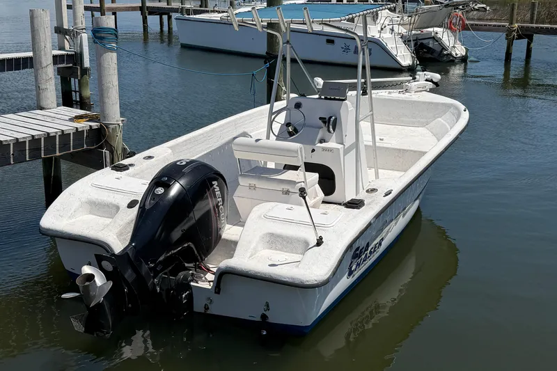 The Image of 2002 Sea Chaser 2100 CC boat docked with Mercury outboard motor. - 0