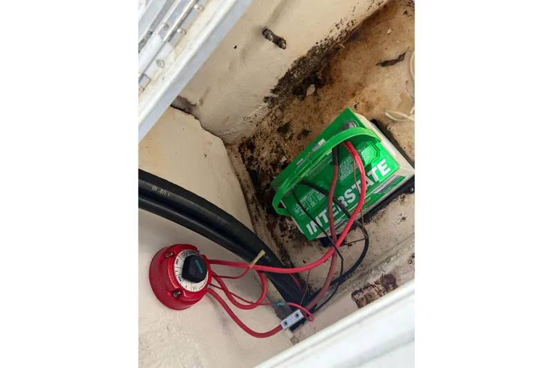 Slide: The Image of Battery compartment of 2002 Sea Chaser 2100 CC with Interstate battery and wiring. - 10