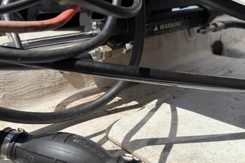 Slide: The Image of Close-up of 2002 Sea Chaser 2100 CC boat cables and hydraulic system. - 11