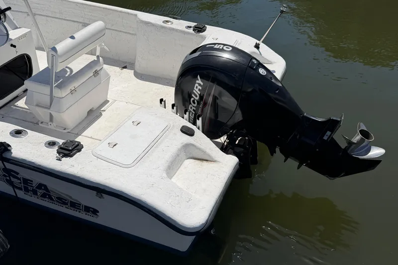 Slide: The Image of 2002 Sea Chaser 2100 CC boat with Mercury outboard motor on calm water. - 3