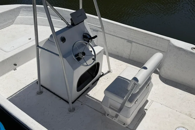 Slide: The Image of 2002 Sea Chaser 2100 CC boat interior with steering console and seating. - 6