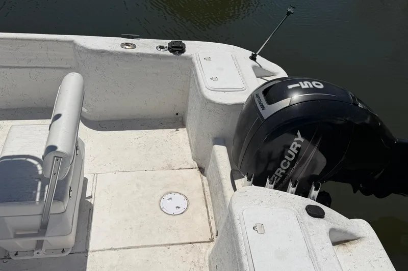 Slide: The Image of 2002 Sea Chaser 2100 CC boat with Mercury outboard motor on calm water. - 7