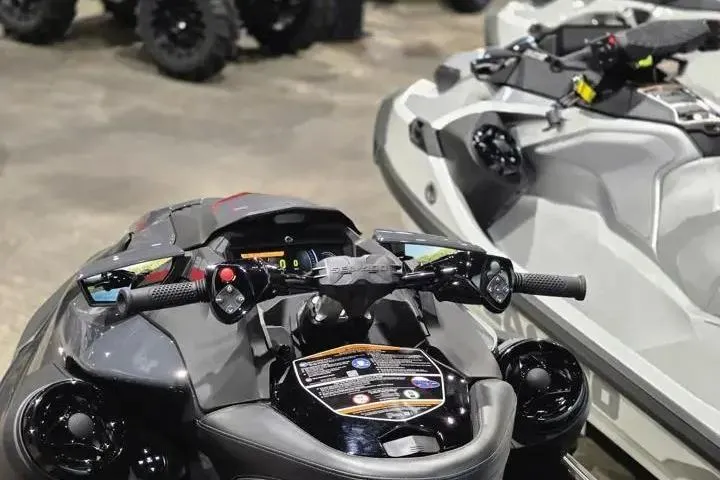 Slide: The Image of 2026 Sea-Doo GTR-X 300 jet ski, black and gray, displayed indoors. - 16