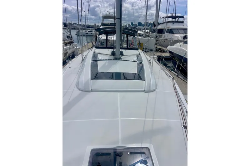 Slide: The Image of 2023 Beneteau Oceanis 51.1 yacht deck view at marina, showcasing sleek design. - 5