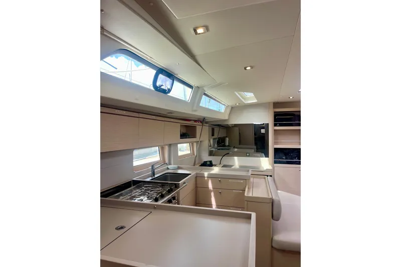 Slide: The Image of Luxurious interior of 2023 Beneteau Oceanis 51.1 yacht with modern kitchen design. - 9