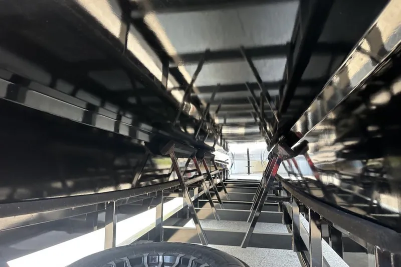 Slide: The Image of Underneath view of a 2018 Wright Performance 420 boat hull with reflective black surface. - 11