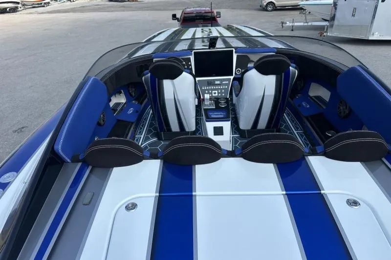 Slide: The Image of 2018 Wright Performance 420 boat interior with blue and white seating and advanced dashboard. - 22