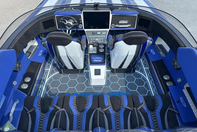 Slide: The Image of Luxurious 2018 Wright Performance 420 boat interior with blue accents and advanced dashboard controls. - 23