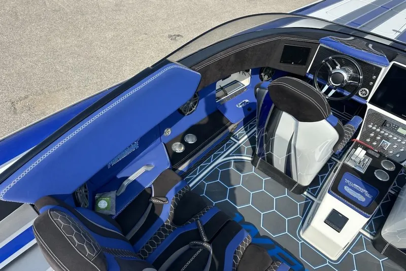 Slide: The Image of Luxurious 2018 Wright Performance 420 boat interior with blue accents and modern dashboard design. - 24