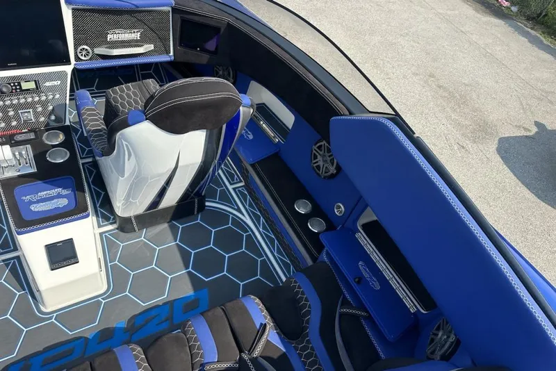 Slide: The Image of Interior of 2018 Wright Performance 420 boat with blue accents and modern controls. - 25