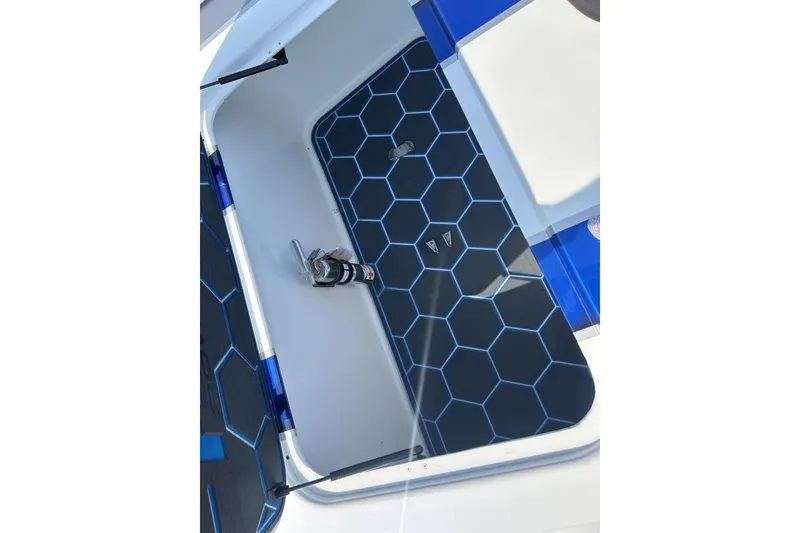 Slide: The Image of 2018 Wright Performance 420 boat storage compartment with hexagonal pattern mat. - 26