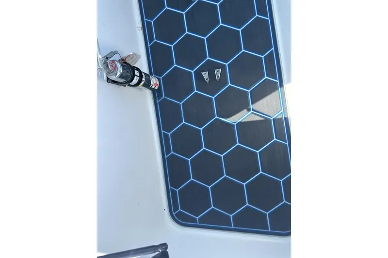 Slide: The Image of 2018 Wright Performance 420 boat deck with hexagonal pattern and mounted fire extinguisher. - 27